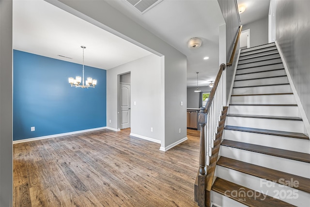 3053 Riker St, Clover, SC 29710 - staircase with baseboards, a chandelier, and wood finished floors
