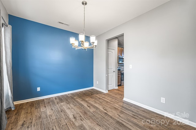3053 Riker St, Clover, SC 29710 - empty room with a chandelier, wood finished floors, and baseboards