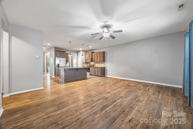 3053 Riker St, Clover, SC 29710 - kitchen featuring stainless steel appliances, a ceiling fan, open floor plan, a center island with sink, and recessed lighting