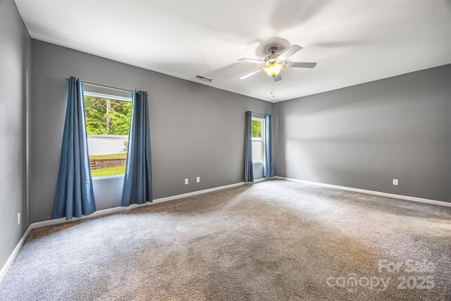 3053 Riker St, Clover, SC 29710 - empty room with plenty of natural light, a ceiling fan, and carpet flooring