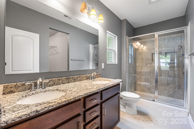 3053 Riker St, Clover, SC 29710 - bathroom with double vanity, a stall shower, tile patterned floors, and toilet