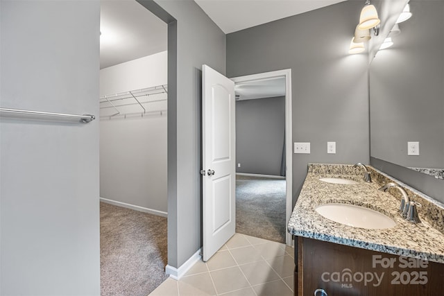 3053 Riker St, Clover, SC 29710 - full bathroom with double vanity, baseboards, a spacious closet, and tile patterned floors