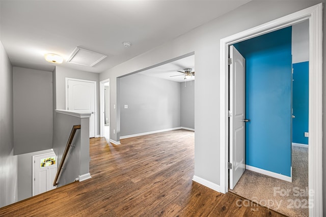 3053 Riker St, Clover, SC 29710 - hallway with an upstairs landing, wood finished floors, baseboards, and attic access