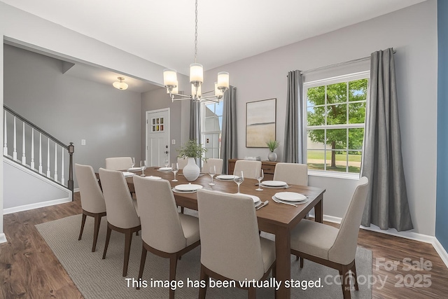 3053 Riker St, Clover, SC 29710 - dining space featuring a chandelier, wood finished floors, stairs, and baseboards