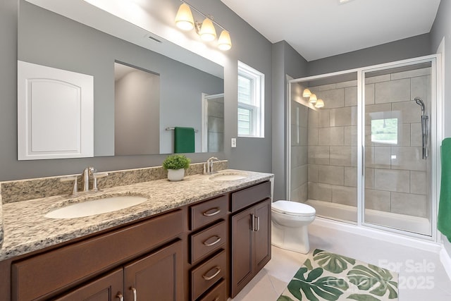 3053 Riker St, Clover, SC 29710 - bathroom with double vanity, toilet, a stall shower, and tile patterned flooring