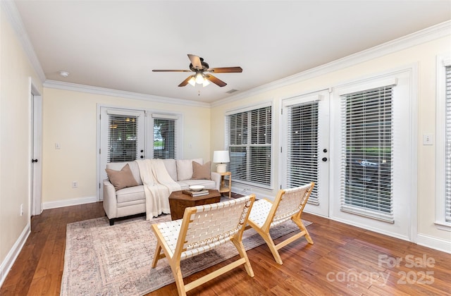 1136 W 1st St, Charlotte, NC 28202 - living area featuring french doors, ornamental molding, a ceiling fan, hardwood / wood-style floors, and baseboards