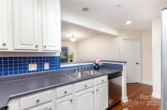 1136 W 1st St, Charlotte, NC 28202 - kitchen with stainless steel dishwasher, a sink, dark countertops, dark wood finished floors, and white cabinetry