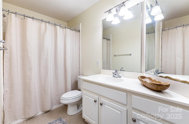 1136 W 1st St, Charlotte, NC 28202 - bathroom featuring tile patterned floors, vanity, and toilet