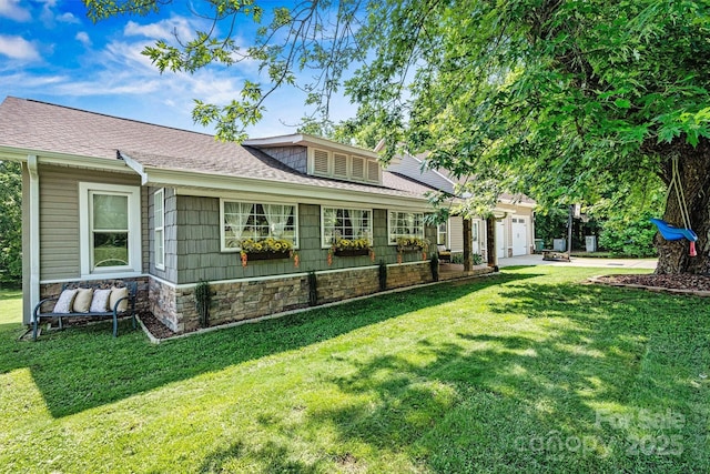 454 N Eastway Dr, Troutman, NC 28166 - view of side of home featuring an attached garage, a lawn, a shingled roof, and stone siding