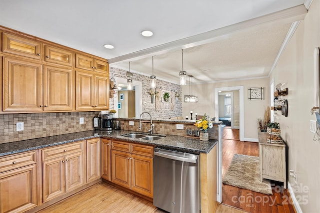 454 N Eastway Dr, Troutman, NC 28166 - kitchen featuring stainless steel dishwasher, a sink, a peninsula, light wood finished floors, and ornamental molding