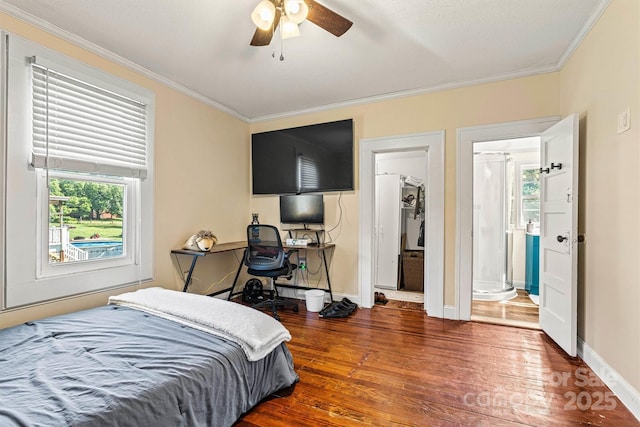 454 N Eastway Dr, Troutman, NC 28166 - bedroom with ornamental molding, wood finished floors, multiple windows, baseboards, and ceiling fan