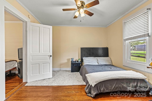 454 N Eastway Dr, Troutman, NC 28166 - bedroom with wood finished floors, ornamental molding, and a ceiling fan
