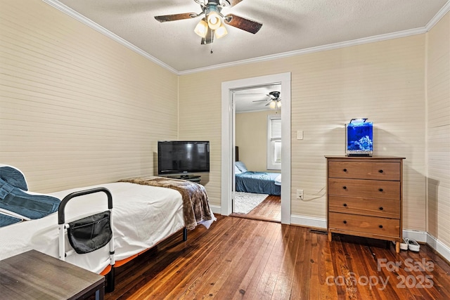 454 N Eastway Dr, Troutman, NC 28166 - bedroom with wood-type flooring, ornamental molding, a textured ceiling, baseboards, and a ceiling fan
