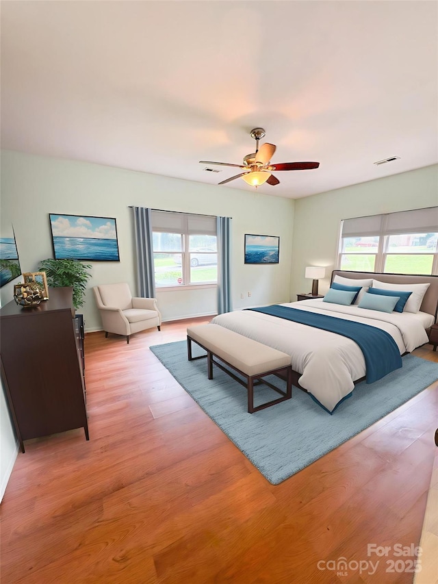 3430 Fincher Blvd, Charlotte, NC 28269 - bedroom featuring multiple windows, light wood-style flooring, ceiling fan, and baseboards