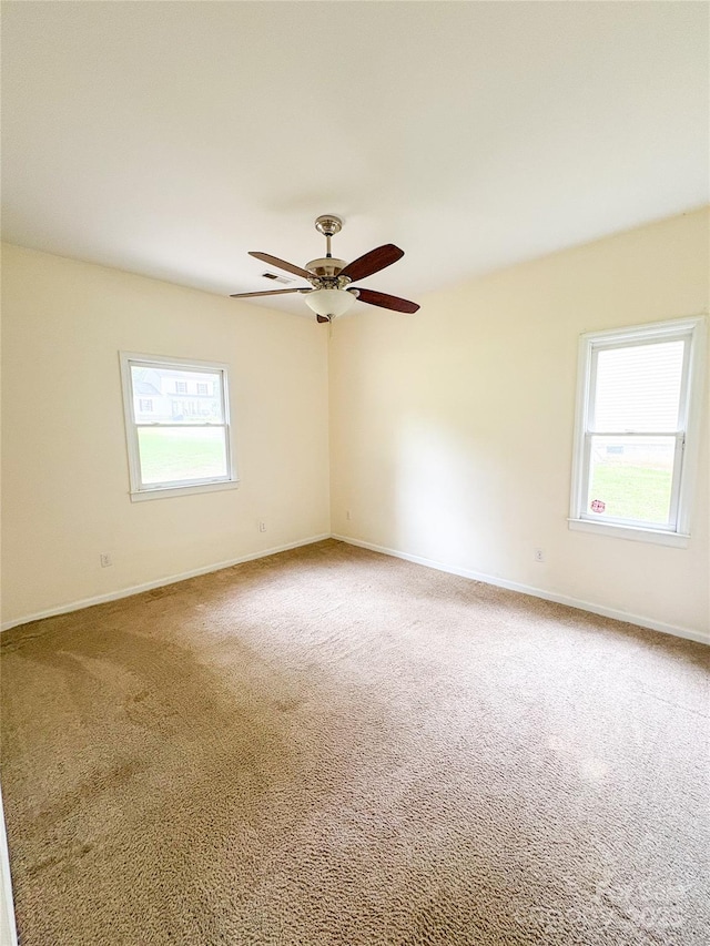 3430 Fincher Blvd, Charlotte, NC 28269 - carpeted spare room featuring healthy amount of natural light, ceiling fan, and baseboards