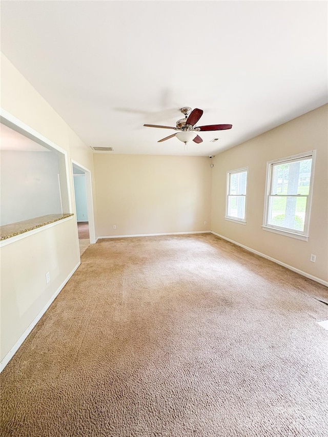 3430 Fincher Blvd, Charlotte, NC 28269 - unfurnished room with a ceiling fan, light colored carpet, and baseboards