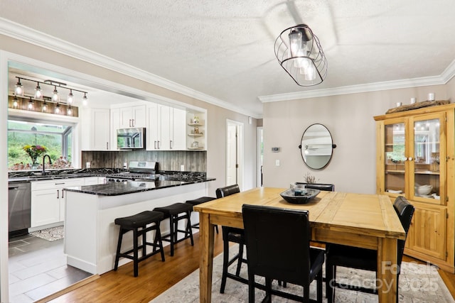 68 Broyles Rd, Hendersonville, NC 28791 - dining room with ornamental molding and a textured ceiling