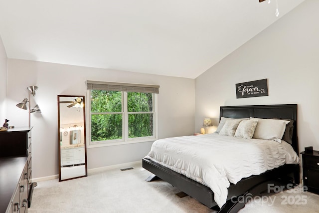 68 Broyles Rd, Hendersonville, NC 28791 - bedroom with light colored carpet, vaulted ceiling, and baseboards