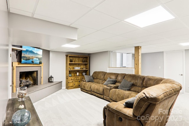 68 Broyles Rd, Hendersonville, NC 28791 - living room featuring light colored carpet, a fireplace with raised hearth, and a paneled ceiling