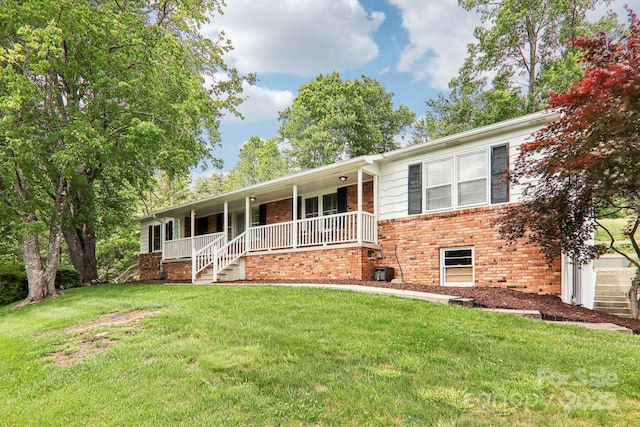 68 Broyles Rd, Hendersonville, NC 28791 - single story home with brick siding, covered porch, and a front yard
