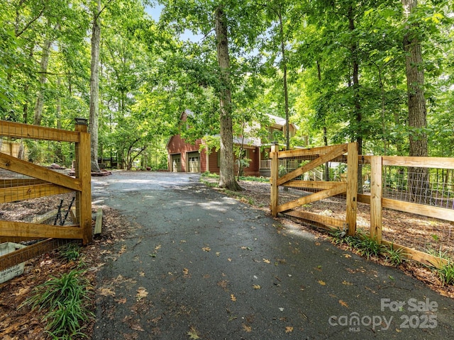 10710 Bristlecone Ct, Mint Hill, NC 28227 - view of asphalt driveway featuring a gate
