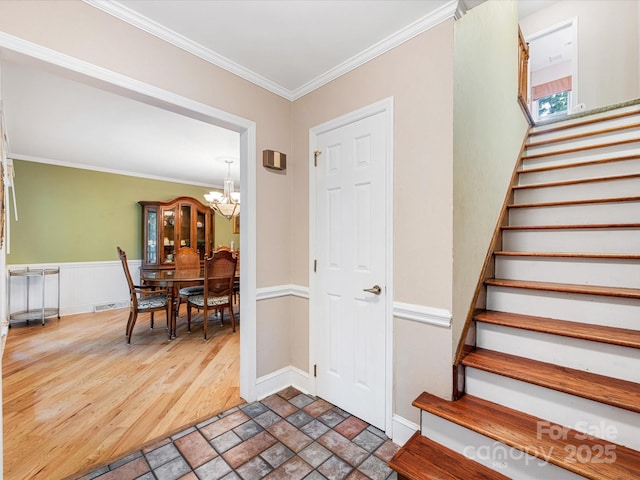 10710 Bristlecone Ct, Mint Hill, NC 28227 - entryway with a chandelier, stairs, ornamental molding, and stone finish floors