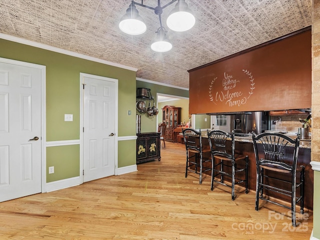 10710 Bristlecone Ct, Mint Hill, NC 28227 - dining area featuring ornamental molding, an ornate ceiling, and wood finished floors