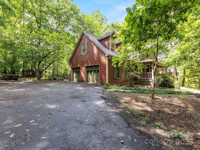 10710 Bristlecone Ct, Mint Hill, NC 28227 - view of front of house featuring covered porch, asphalt driveway, and a garage