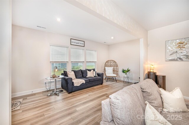 705 Hinterland Ln, Matthews, NC 28104 - living room featuring wood finished floors, baseboards, and recessed lighting