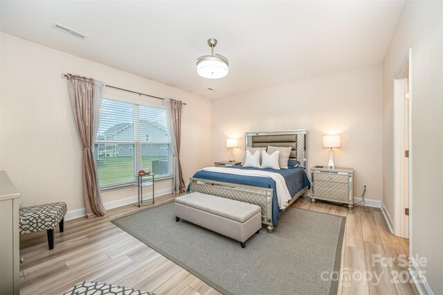 705 Hinterland Ln, Matthews, NC 28104 - bedroom featuring light wood-style flooring and baseboards
