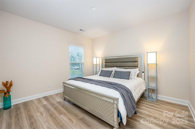 705 Hinterland Ln, Matthews, NC 28104 - bedroom with light wood-type flooring and baseboards