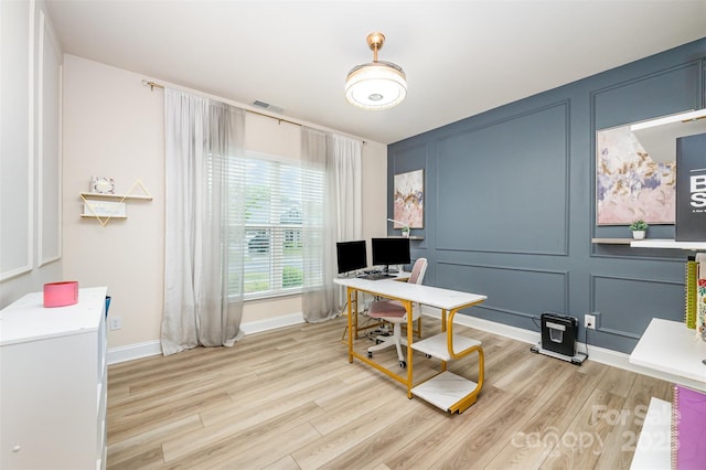 705 Hinterland Ln, Matthews, NC 28104 - home office featuring a decorative wall, light wood-style floors, and baseboards