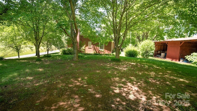 6487 NC-18 Rd, Connelly Springs, NC 28612 - view of green lawn with a pole building and an outdoor structure