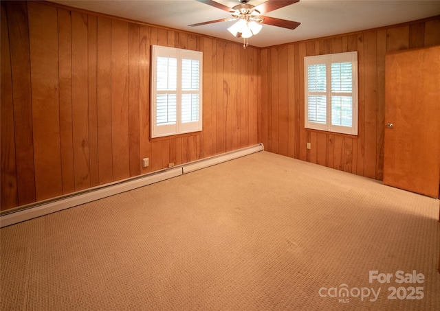 6487 NC-18 Rd, Connelly Springs, NC 28612 - carpeted spare room featuring plenty of natural light, ceiling fan, a baseboard heating unit, and wooden walls