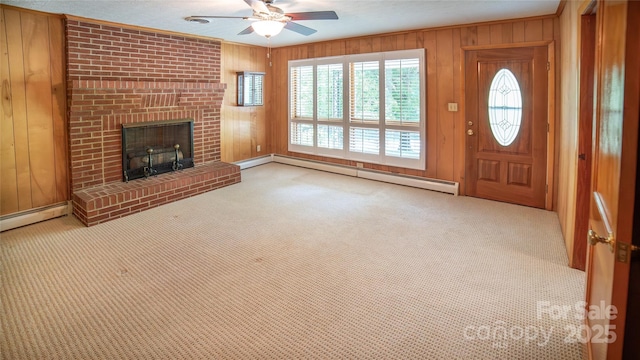 6487 NC-18 Rd, Connelly Springs, NC 28612 - unfurnished living room featuring a baseboard heating unit, a ceiling fan, carpet floors, wooden walls, and a brick fireplace