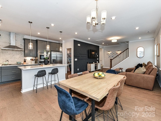 5811 Mantle Way, Kannapolis, NC 28081 - dining room featuring stairway, recessed lighting, crown molding, light wood-style flooring, and a chandelier