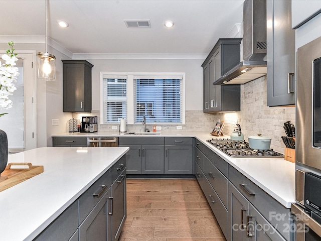 5811 Mantle Way, Kannapolis, NC 28081 - kitchen with wall chimney exhaust hood, appliances with stainless steel finishes, a sink, light countertops, and ornamental molding