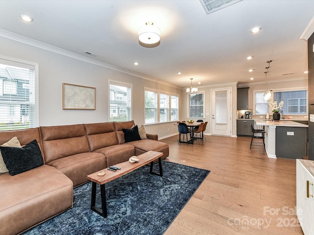 5811 Mantle Way, Kannapolis, NC 28081 - living area with ornamental molding, a chandelier, recessed lighting, light wood-style floors, and baseboards