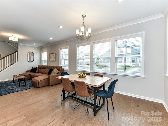5811 Mantle Way, Kannapolis, NC 28081 - dining area with ornamental molding, stairs, a chandelier, light wood-type flooring, and baseboards