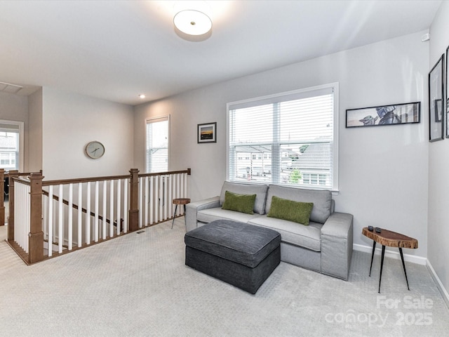 5811 Mantle Way, Kannapolis, NC 28081 - carpeted living area with healthy amount of natural light and baseboards