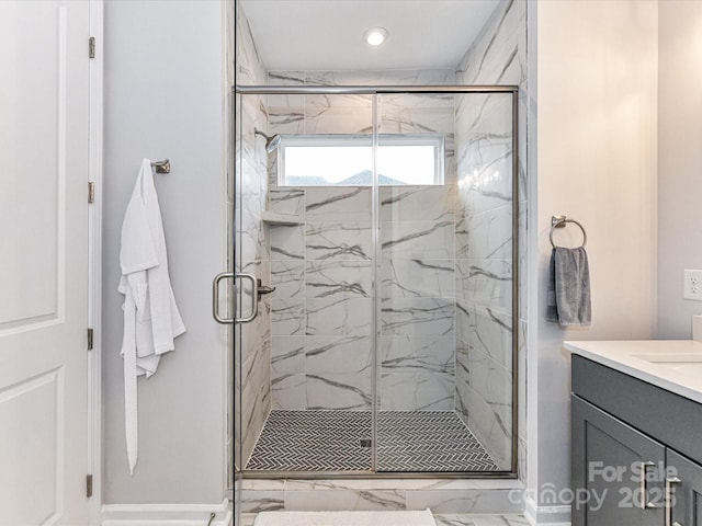 5811 Mantle Way, Kannapolis, NC 28081 - bathroom featuring marble look tiles, a marble finish shower, vanity, baseboards, and recessed lighting