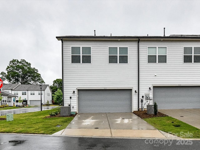 5811 Mantle Way, Kannapolis, NC 28081 - view of front of house featuring a garage, driveway, central AC, and a front yard