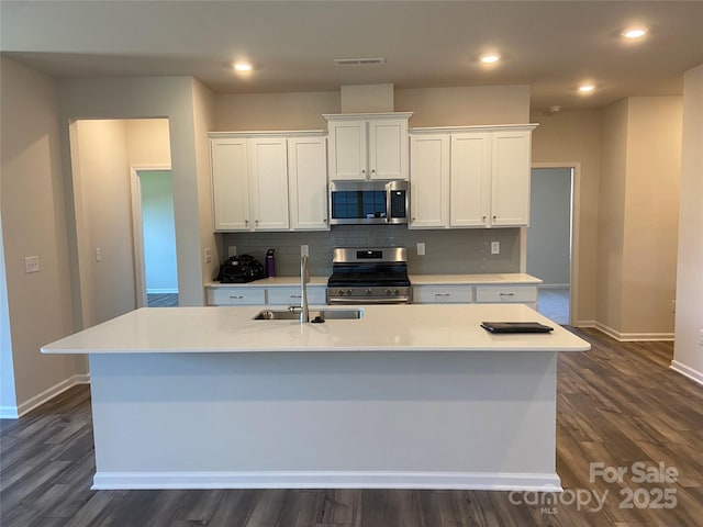 108 Red Juniper Way, Statesville, NC 28625 - kitchen featuring stainless steel appliances, a sink, baseboards, white cabinets, and recessed lighting