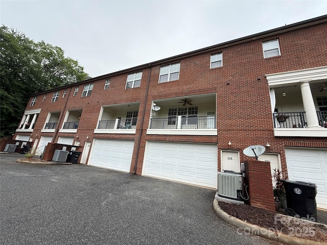 129 Steinbeck Way Unit B, Mooresville, NC 28117 - view of building exterior with central AC, driveway, and an attached garage