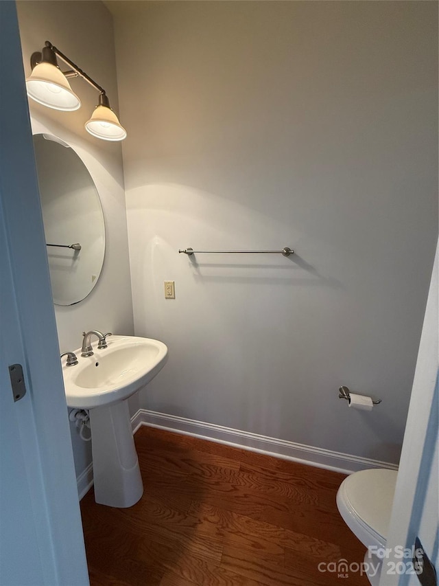 129 Steinbeck Way Unit B, Mooresville, NC 28117 - bathroom featuring toilet, wood finished floors, and baseboards