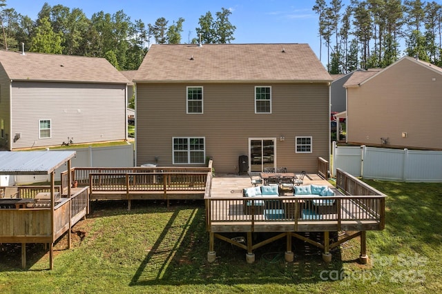 2021 Tarzi Ln, Charlotte, NC 28215 - back of property featuring a deck, a fenced backyard, and an outdoor living space