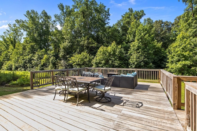 2021 Tarzi Ln, Charlotte, NC 28215 - wooden deck with outdoor dining area and an outdoor living space