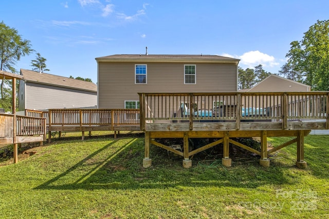 2021 Tarzi Ln, Charlotte, NC 28215 - back of property featuring a deck and a lawn