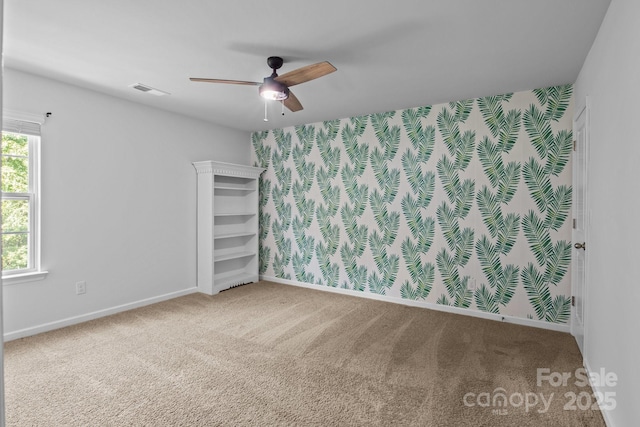 2021 Tarzi Ln, Charlotte, NC 28215 - carpeted spare room with a ceiling fan and baseboards