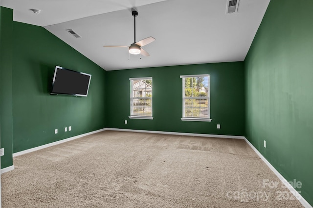 2021 Tarzi Ln, Charlotte, NC 28215 - carpeted empty room featuring vaulted ceiling, ceiling fan, and a smoke detector